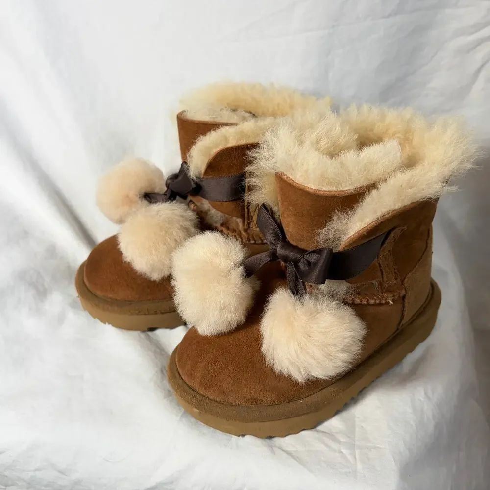 UGG Toddler Gita chestnut boots.  Front bow pom-poms.  Size 8T. Worn once